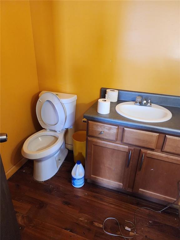 6958 Main Street Lithonia, GA 30058 - Photo 49 of 55 a bathroom with a granite countertop toilet and a sink