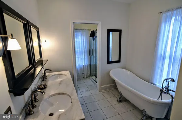 a bathroom with a sink and mirror