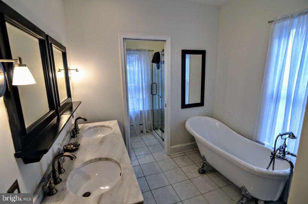 1029 30th Street Northwest Washington, DC 20007 - Photo 15 of 40 a bathroom with a sink and mirror