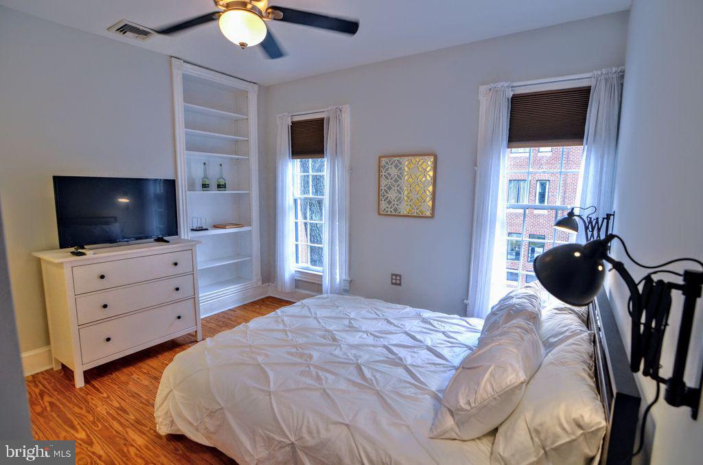 1029 30th Street Northwest Washington, DC 20007 - Photo 20 of 40 a bedroom with a bed and a flat screen tv