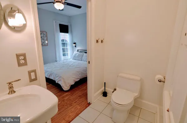 a bathroom with a sink shower and a mirror