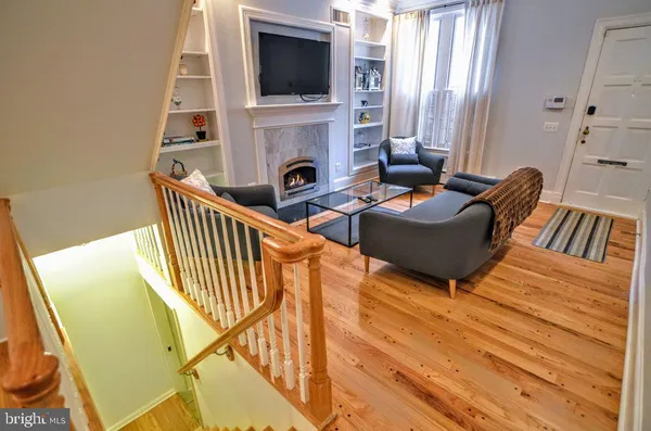 a living room with furniture and a chair