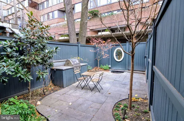 a view of a patio with a table and chairs in patio