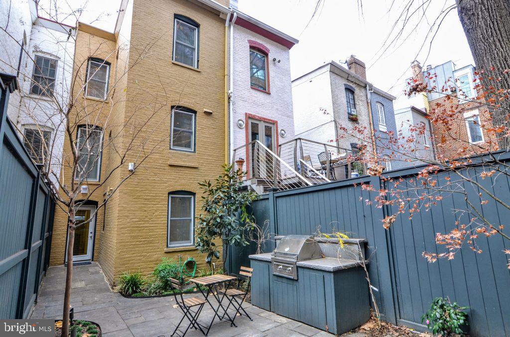1029 30th Street Northwest Washington, DC 20007 - Photo 37 of 40 a view of a patio with a table and chairs in patio