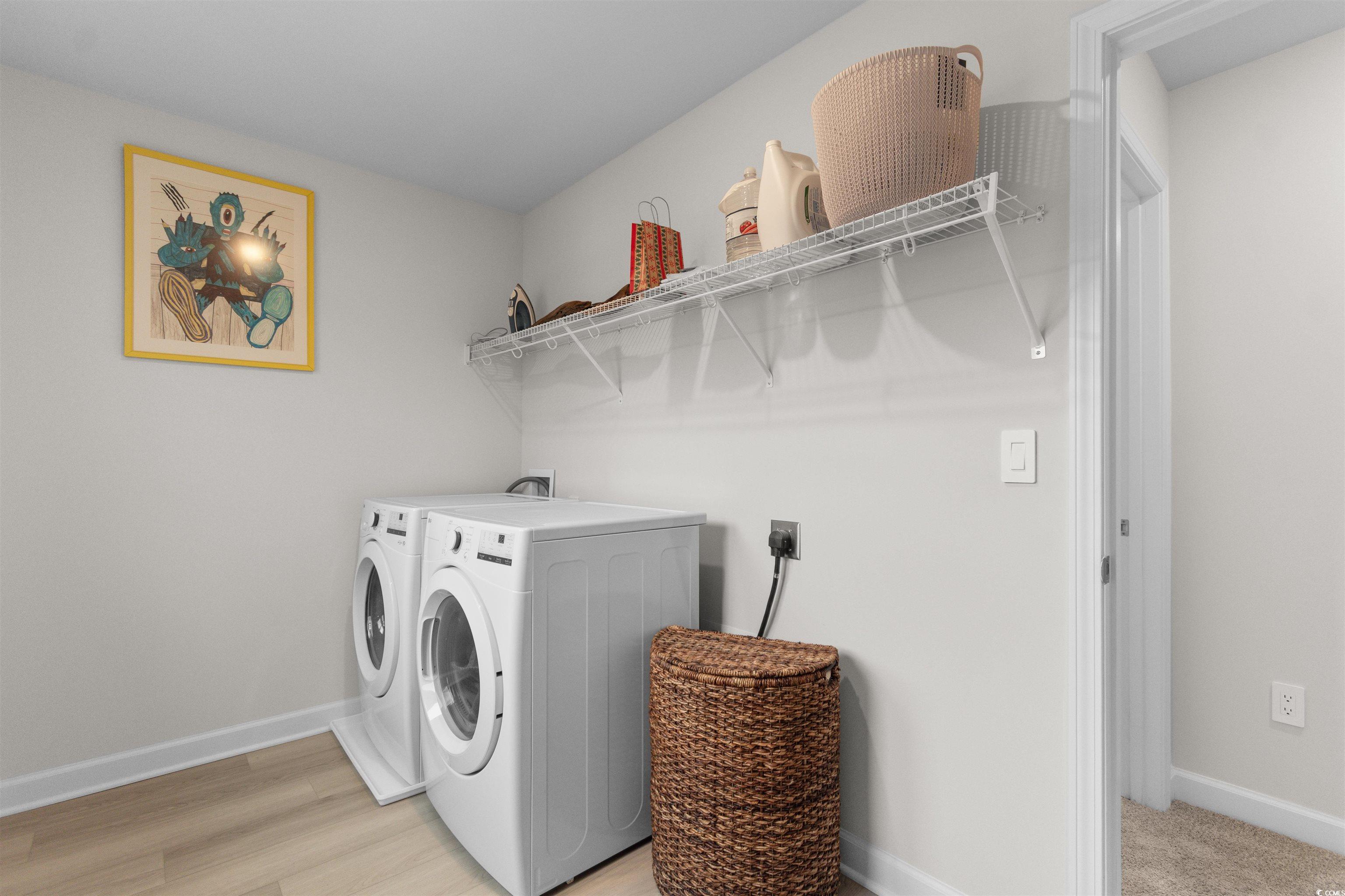 4059 Bayhill Street Myrtle Beach, SC 29579 - Photo 16 of 40 Laundry area with washer and dryer and light wood-style floors