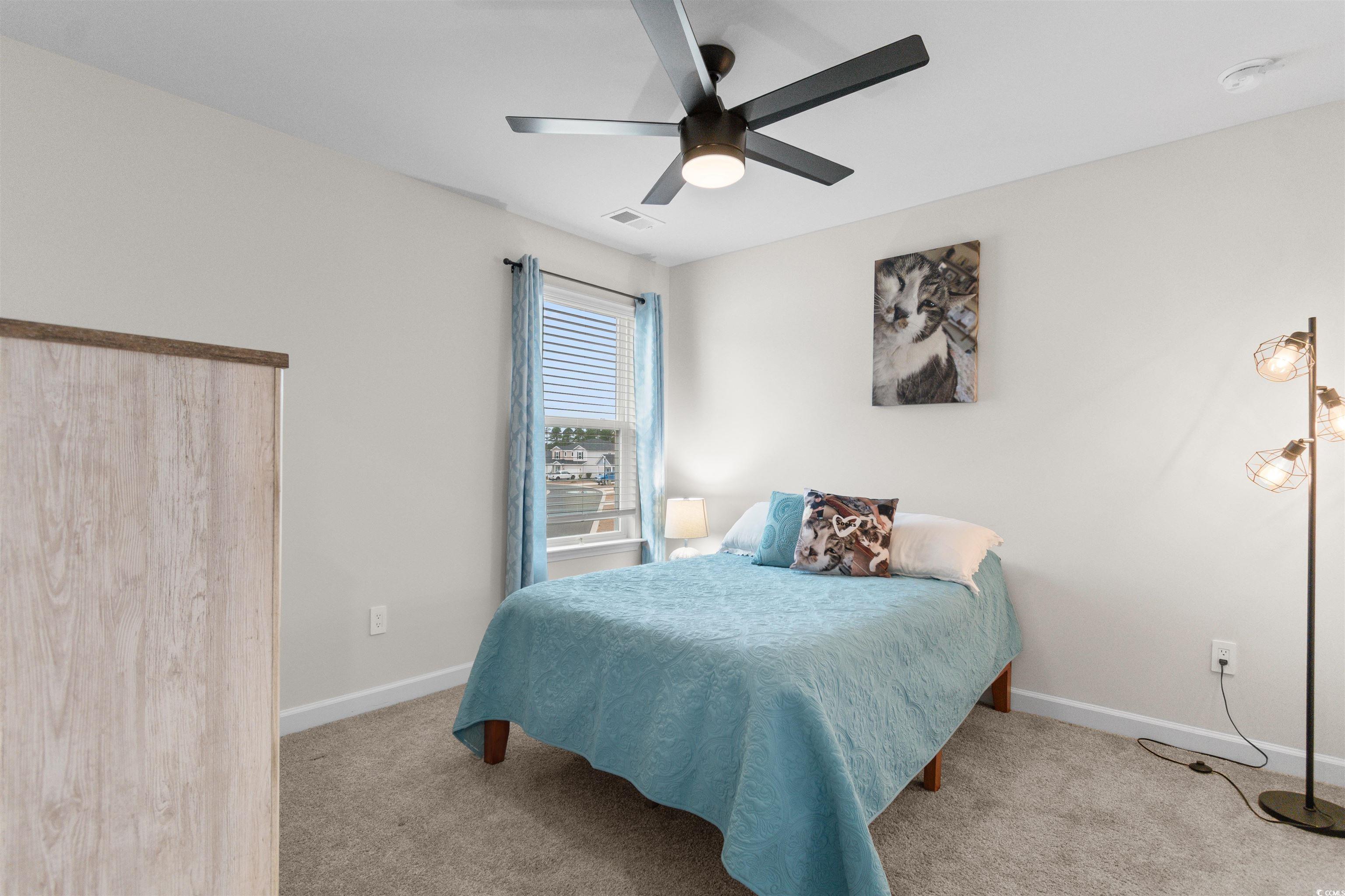 4059 Bayhill Street Myrtle Beach, SC 29579 - Photo 25 of 40 Bedroom with light colored carpet and a ceiling fan