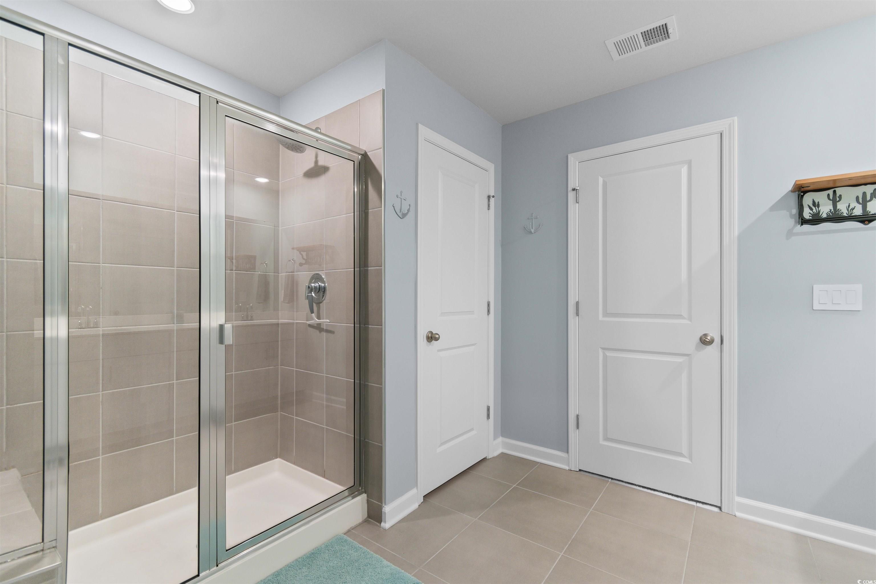 4059 Bayhill Street Myrtle Beach, SC 29579 - Photo 26 of 40 Full bath featuring a shower stall and light tile patterned floors