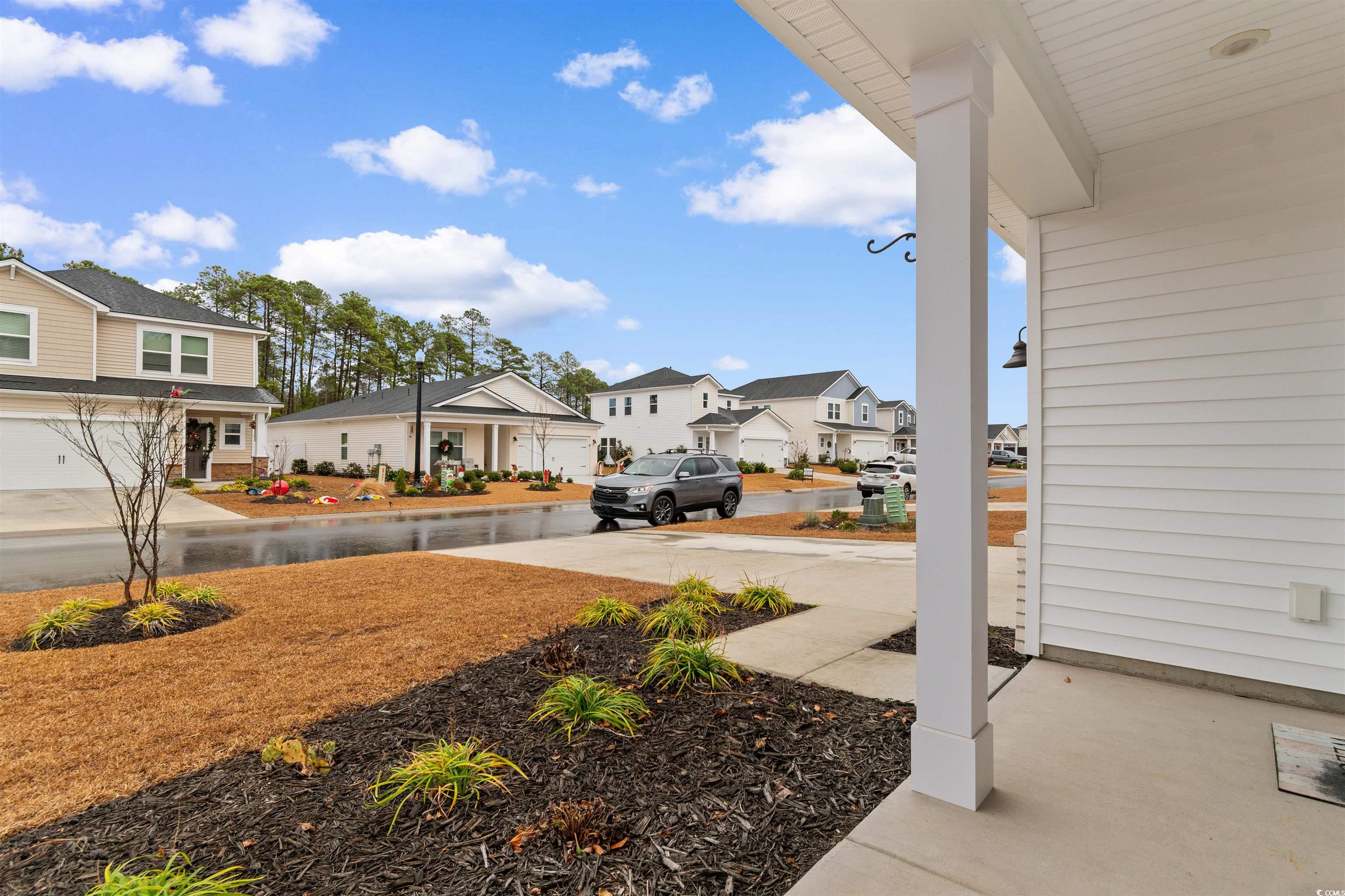 4059 Bayhill Street Myrtle Beach, SC 29579 - Photo 3 of 40 View of yard with a residential view and a porch