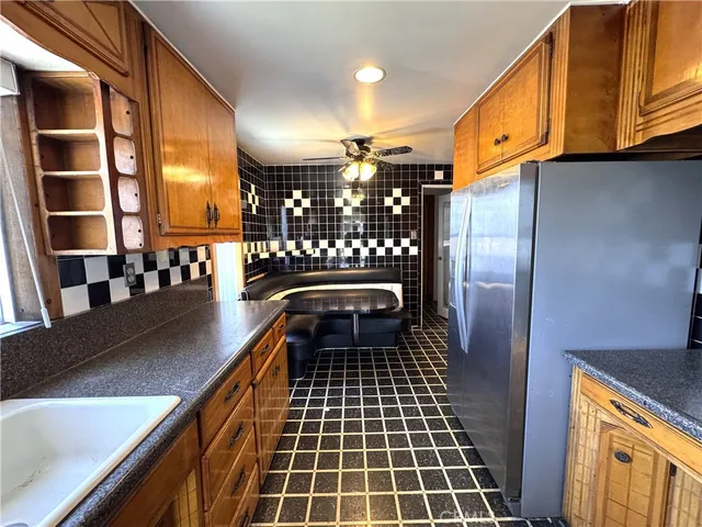 a hallway with a black white checkered table and chairs
