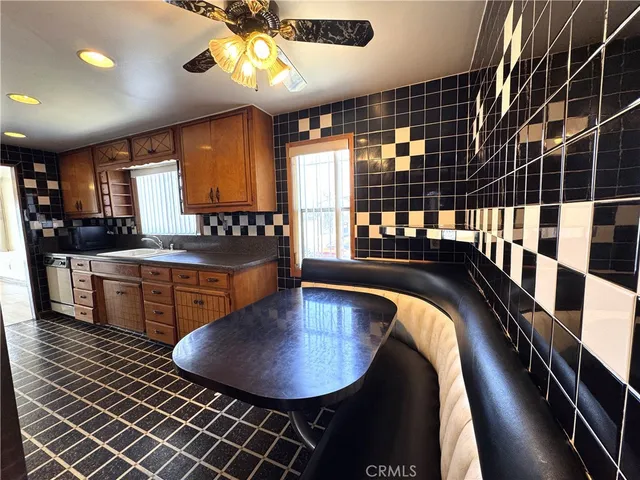 a kitchen with a refrigerator and washer
