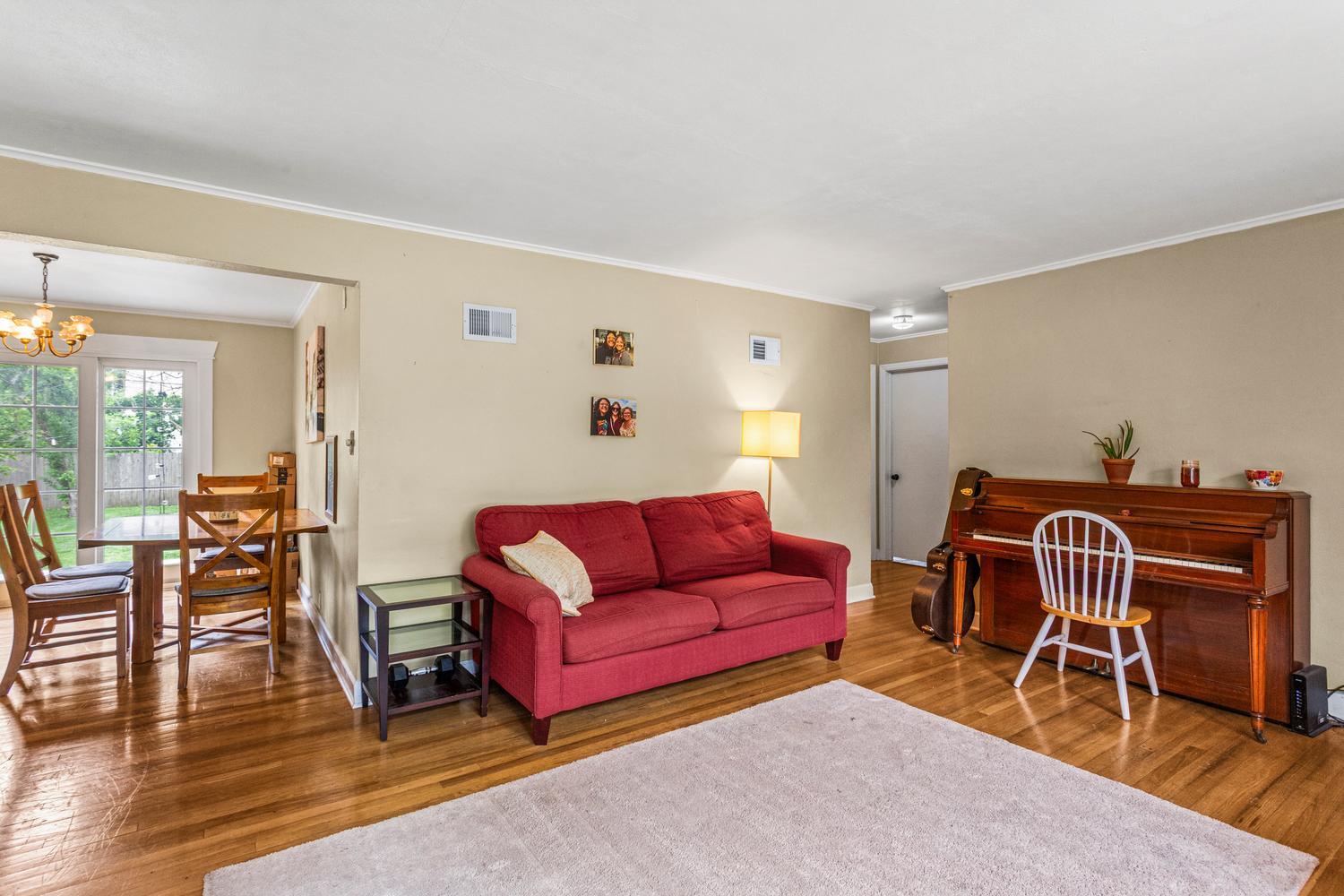 1117 West Union Street Champaign, IL 61821 - Photo 12 of 29 a living room with furniture and a wooden floor