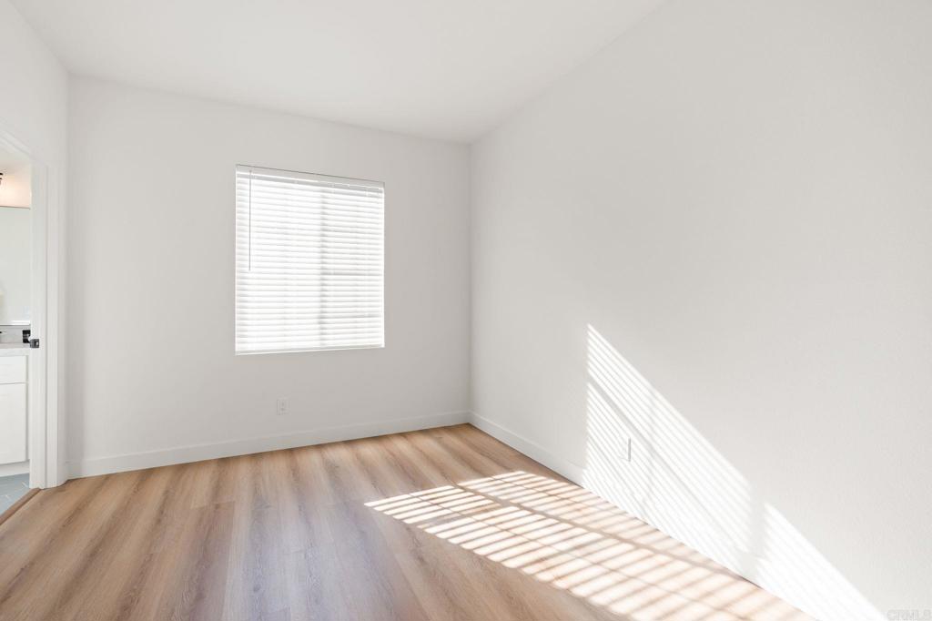 3114 Via Puerta Carlsbad, CA 92009 - Photo 24 of 39 a view of wooden floor in an empty room