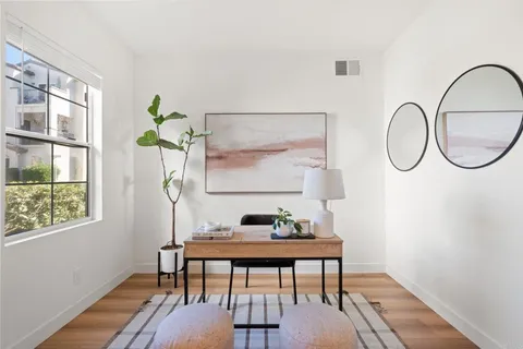 a workspace with furniture and window