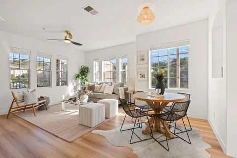 a view of a dining room with furniture window and outside view