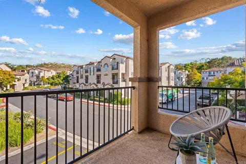 a view of a chair and table in the balcony