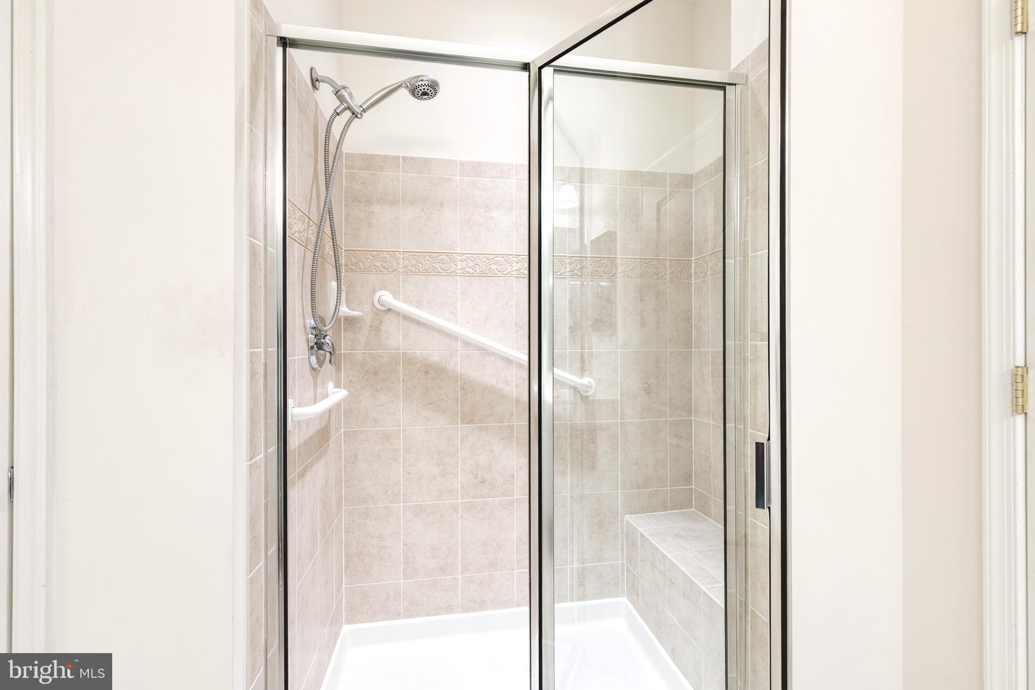 7305 Brookview Road, Unit 308 Elkridge, MD 21075 - Photo 18 of 28 Large, tiled shower w/handrails