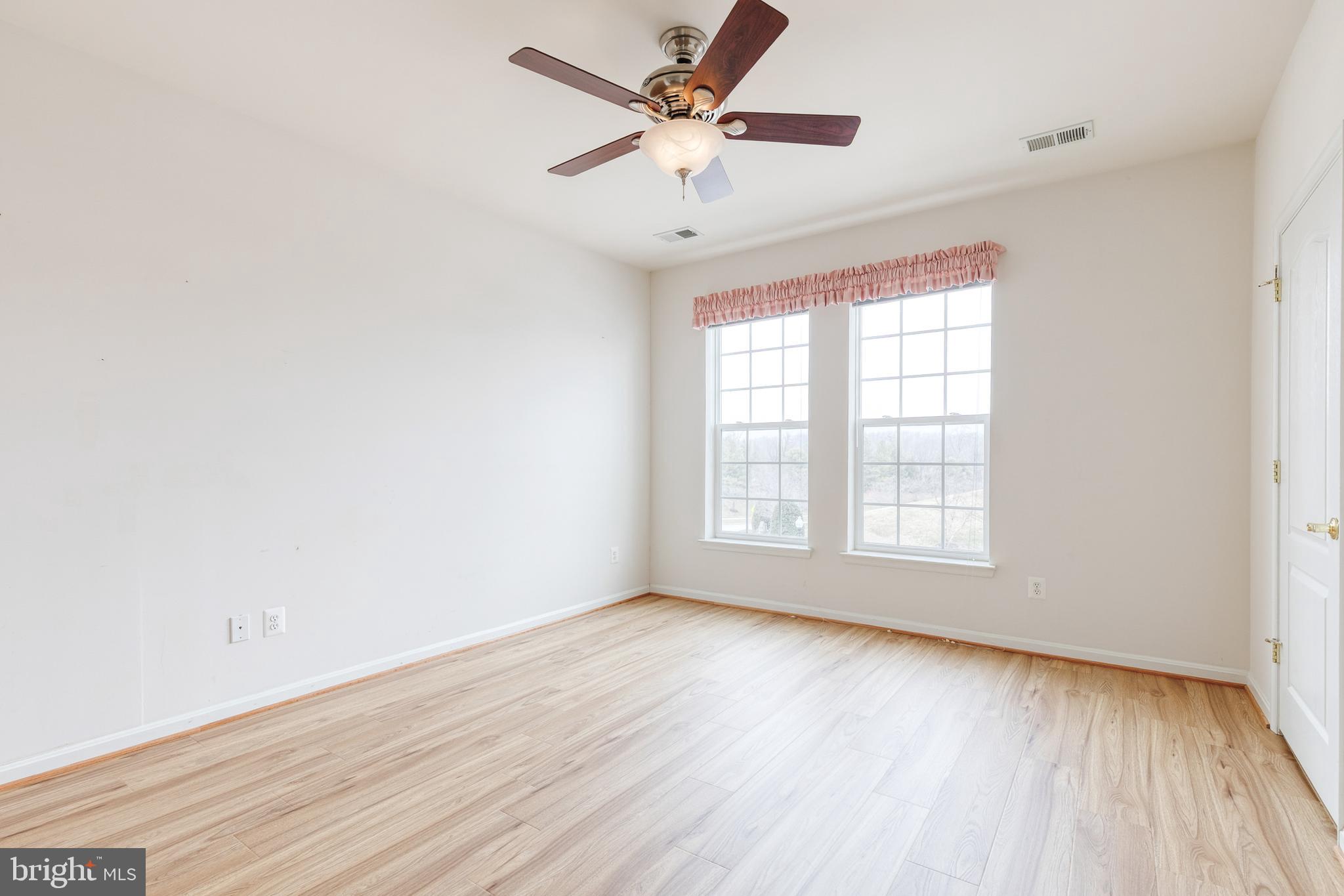 7305 Brookview Road, Unit 308 Elkridge, MD 21075 - Photo 19 of 28 New luxury vinyl in second bedroom w/ceiling fan