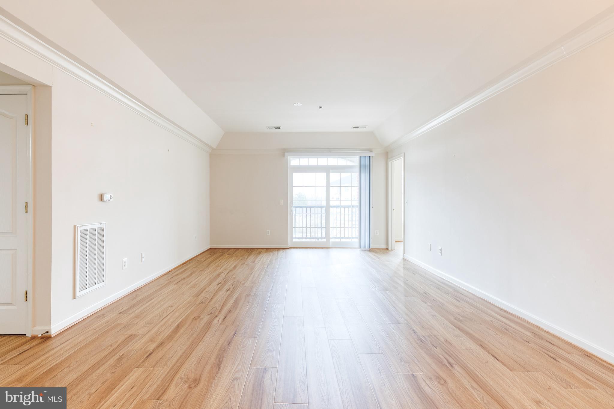 7305 Brookview Road, Unit 308 Elkridge, MD 21075 - Photo 4 of 28 Neutral paint and large open living space.