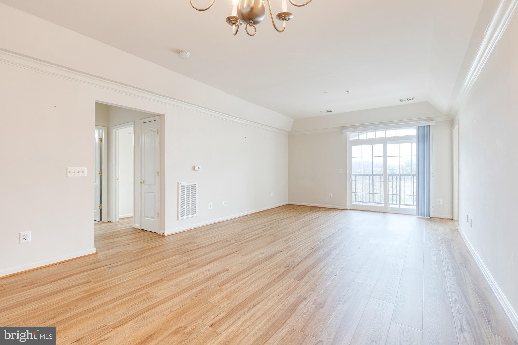 7305 Brookview Road, Unit 308 Elkridge, MD 21075 - Photo 5 of 28 Main living area facing outside deck/2nd bedroom