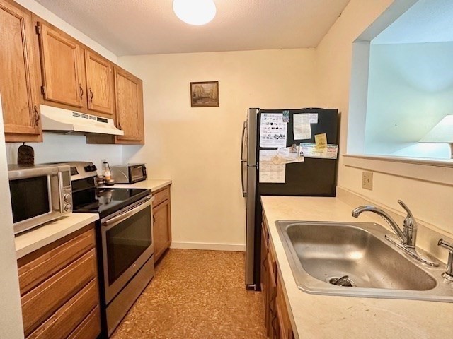 48 Evergreen Road, Unit 313 Leeds, MA 01053 - Photo 12 of 19 a kitchen with stainless steel appliances granite countertop a sink stove and refrigerator