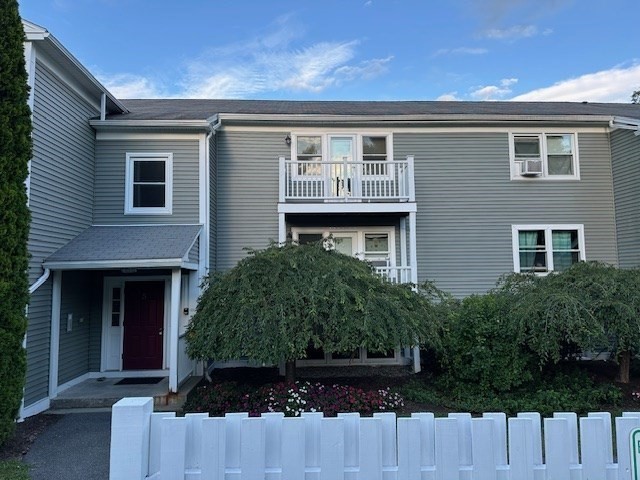 48 Evergreen Road, Unit 313 Leeds, MA 01053 - Photo 18 of 19 a front view of a house with a yard