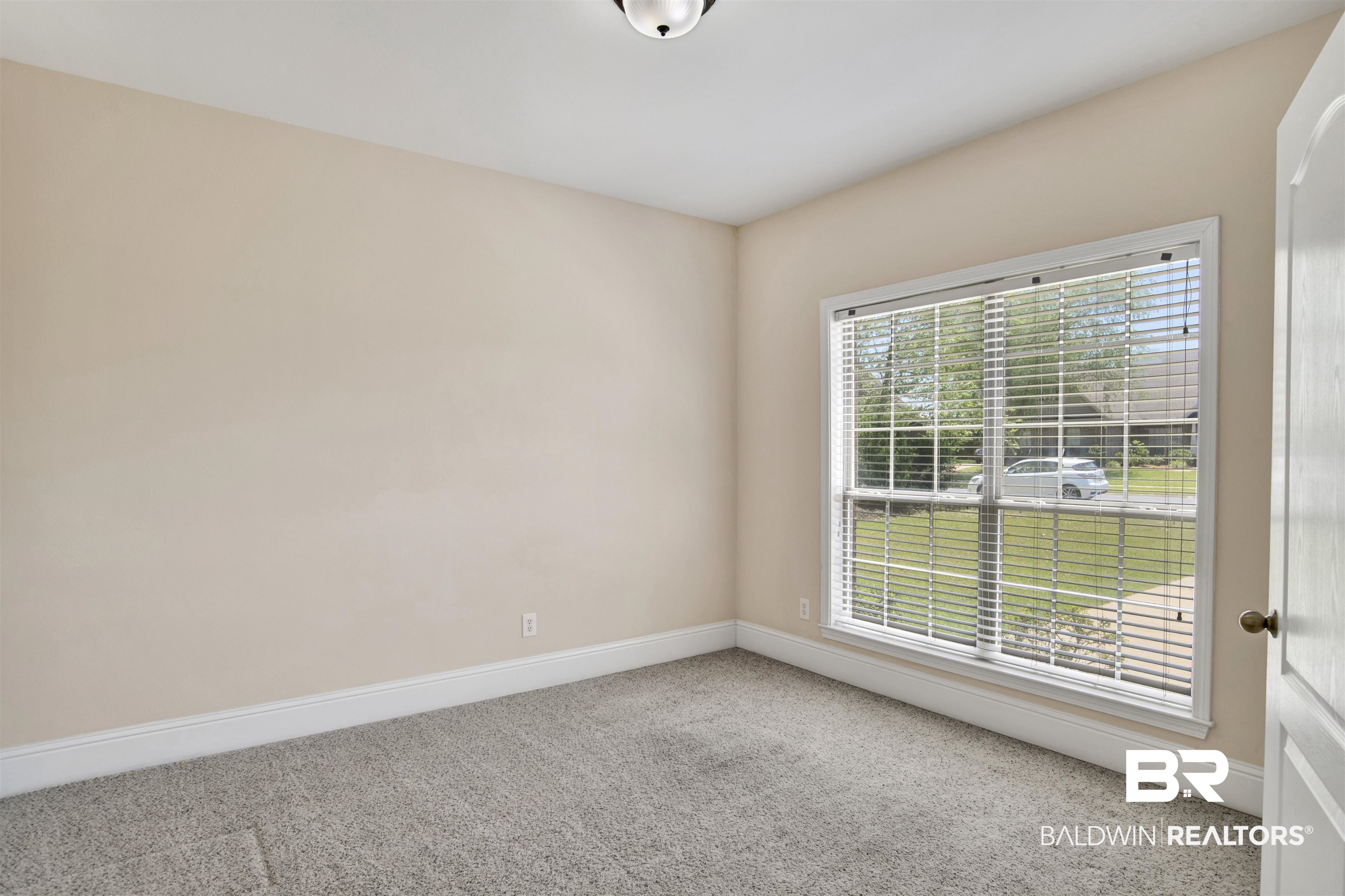 10910 Roanoke Loop Daphne, AL 36526 - Photo 8 of 33 Carpeted spare room with baseboards