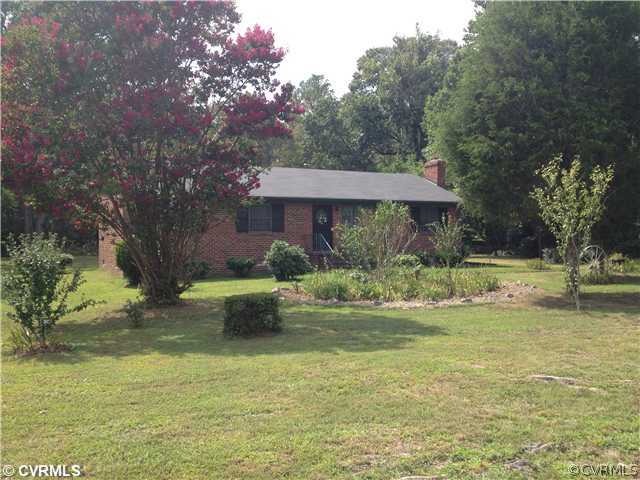 8392 Buffin Road Henrico, VA 23231 - Photo 1 of 9 a view of a house with a yard table and chairs
