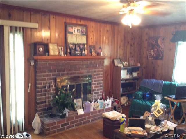8392 Buffin Road Henrico, VA 23231 - Photo 2 of 9 a living room with furniture and a fireplace