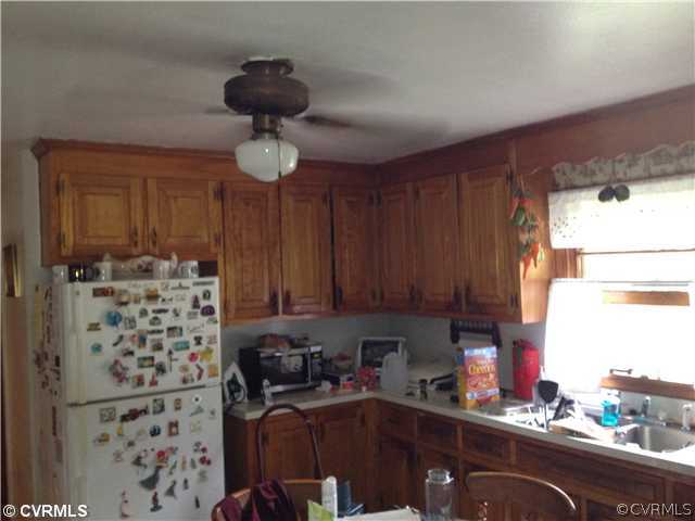 8392 Buffin Road Henrico, VA 23231 - Photo 3 of 9 a kitchen with stainless steel appliances a sink a refrigerator and a window