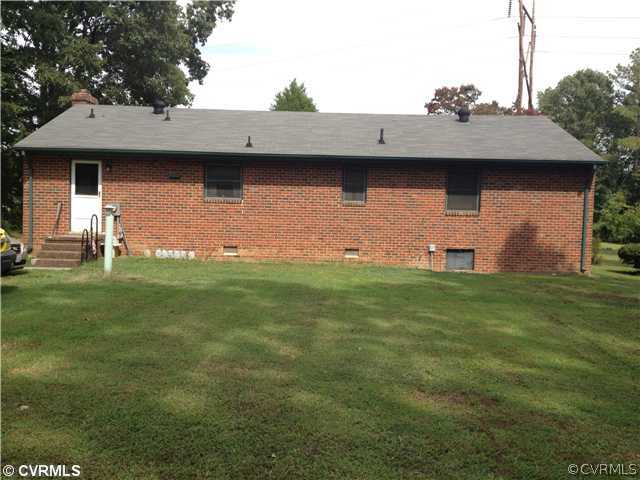 8392 Buffin Road Henrico, VA 23231 - Photo 4 of 9 a view of a wooden house with a yard
