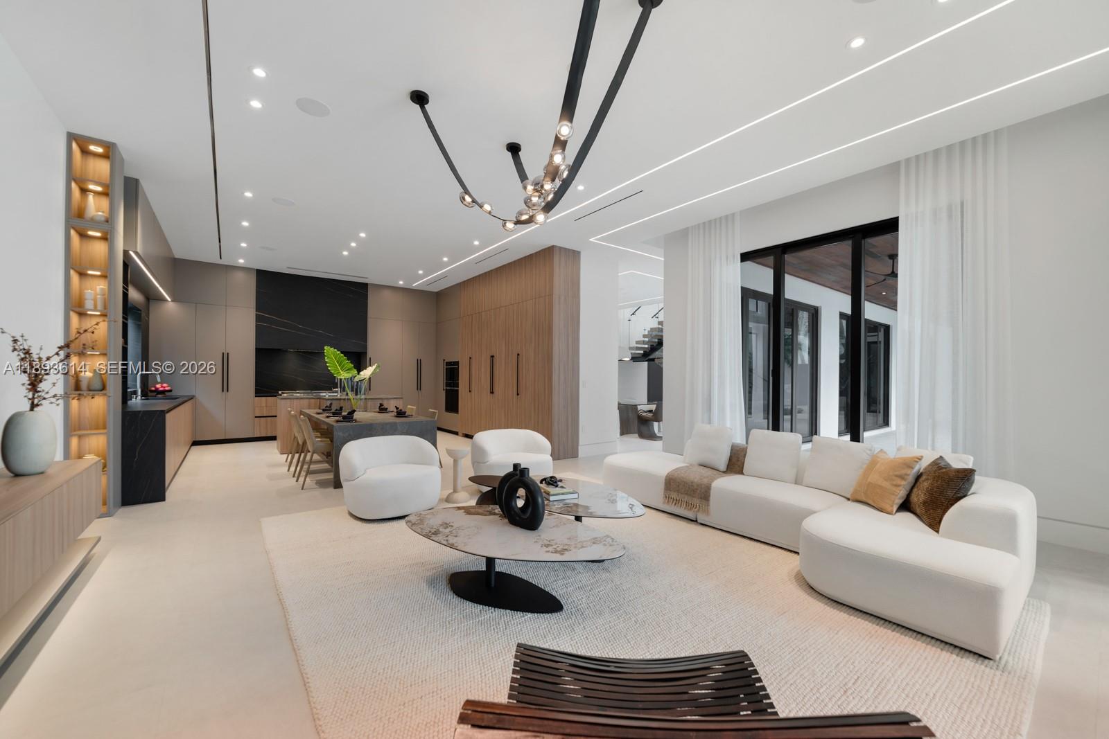 9900 Southwest 125th Avenue Miami, FL 33186 - Photo 14 of 83 a living room with furniture and a chandelier