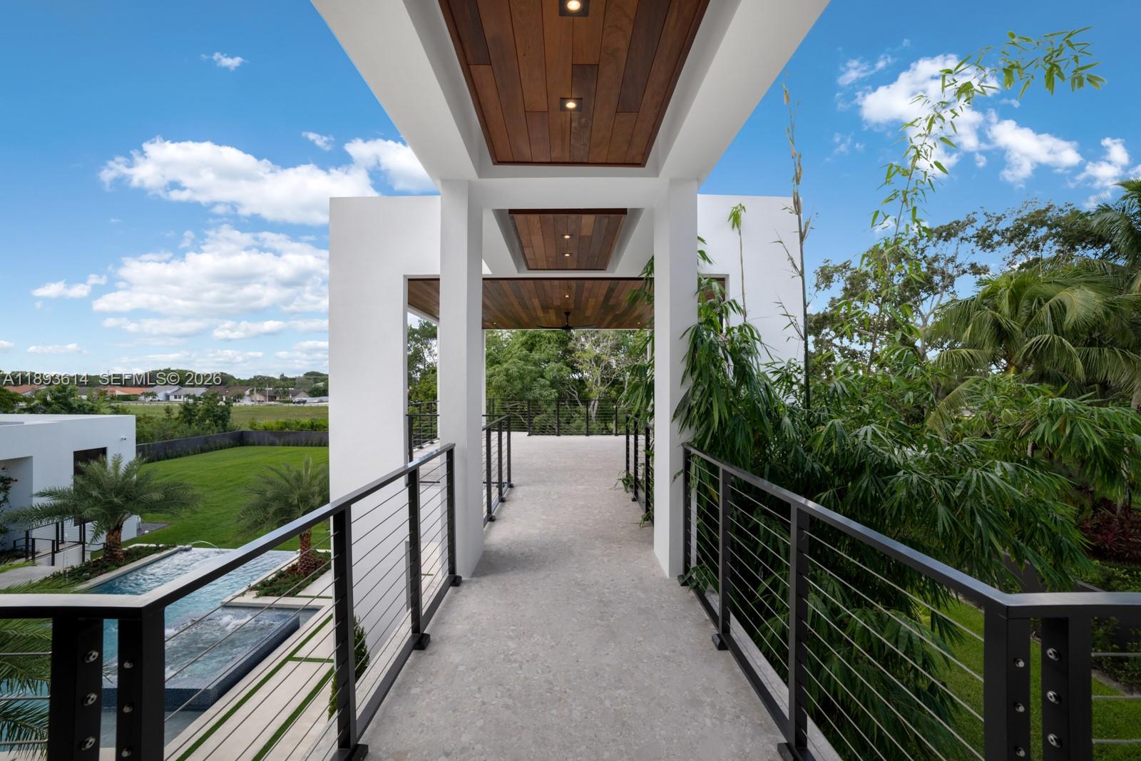 9900 Southwest 125th Avenue Miami, FL 33186 - Photo 33 of 83 a view of a balcony with wooden floor