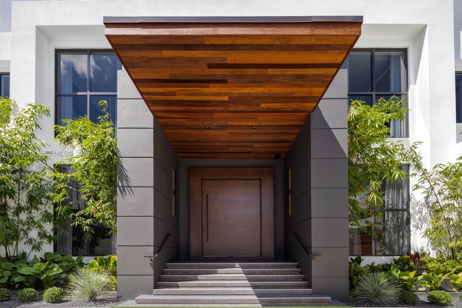 9900 Southwest 125th Avenue Miami, FL 33186 - Photo 4 of 83 a front view of house with a garden