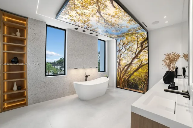 a view of an empty room with windows and closet