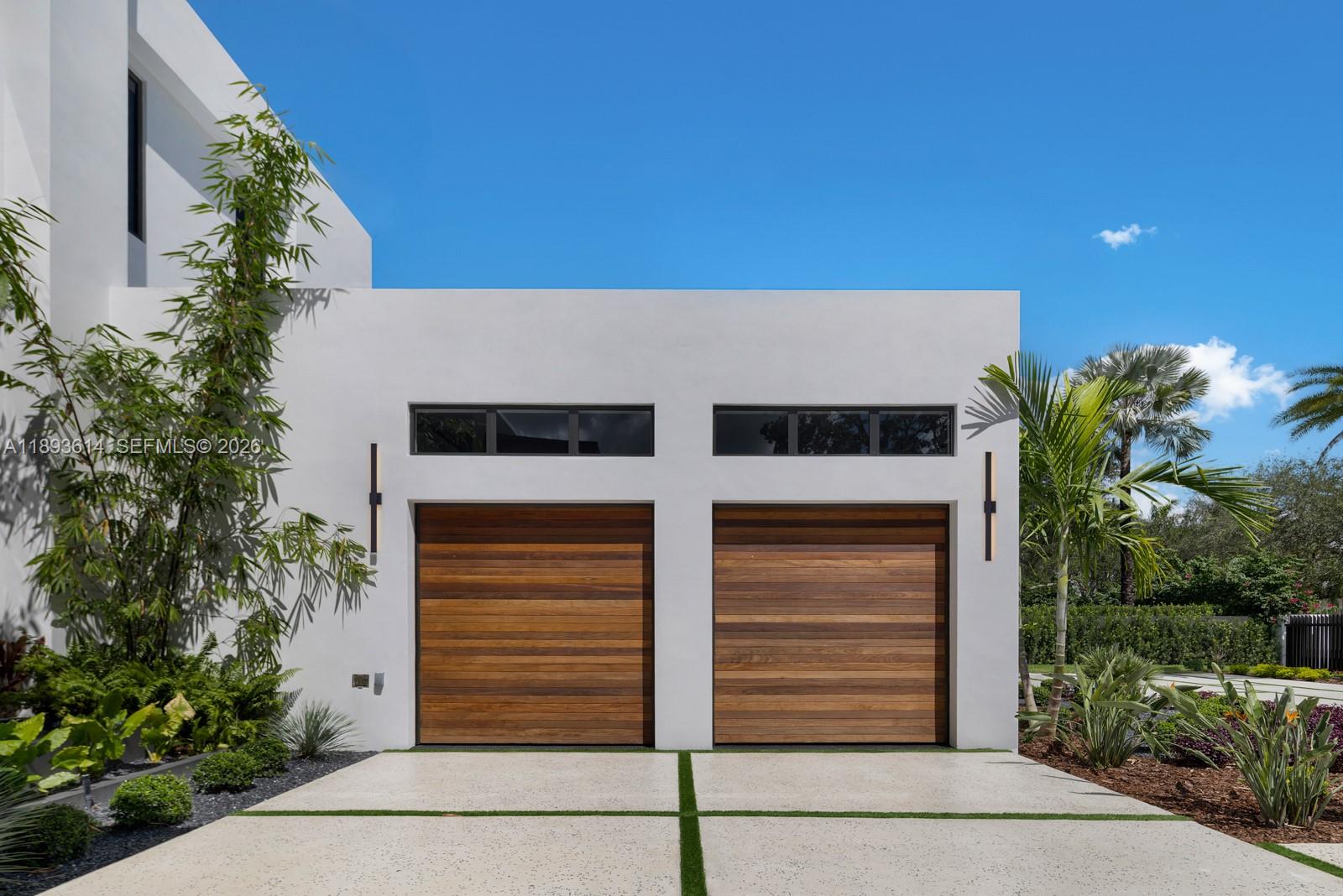 9900 Southwest 125th Avenue Miami, FL 33186 - Photo 62 of 83 a front view of a house with a garden