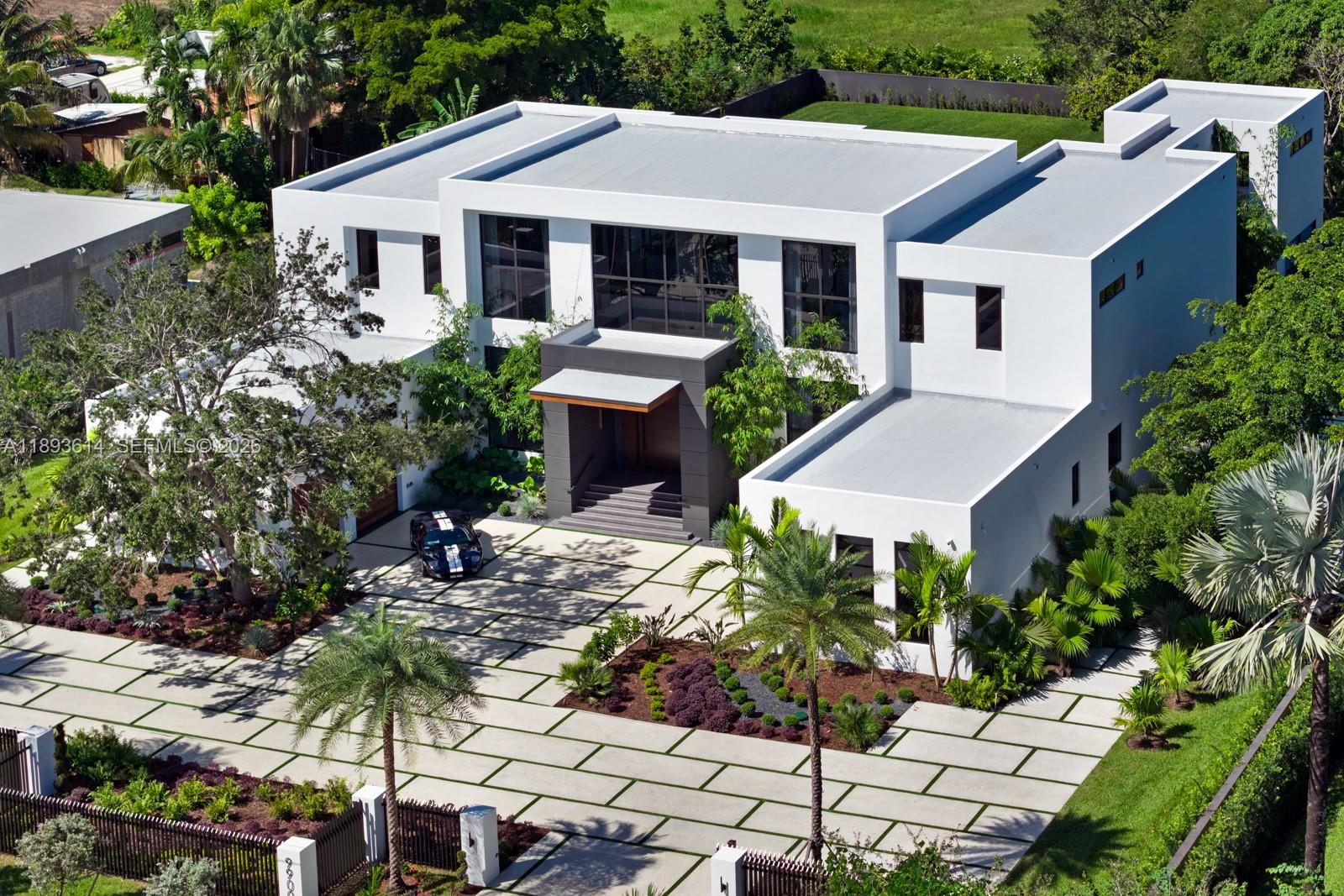 9900 Southwest 125th Avenue Miami, FL 33186 - Photo 82 of 83 a aerial view of a house with a yard and potted plants