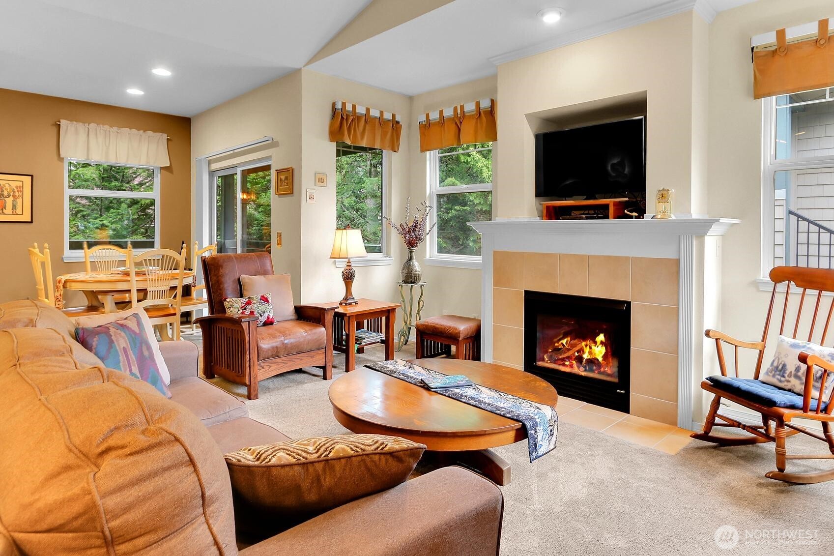 1500 South 18th Street, Unit F202 Renton, WA 98055 - Photo 1 of 20 a living room with furniture a flat screen tv and a fireplace