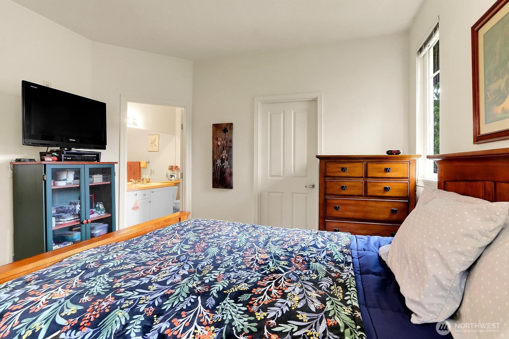 1500 South 18th Street, Unit F202 Renton, WA 98055 - Photo 12 of 20 a bedroom with a bed and flat screen tv