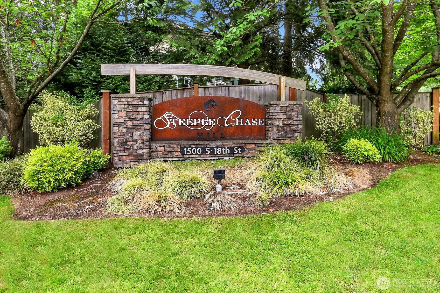 1500 South 18th Street, Unit F202 Renton, WA 98055 - Photo 2 of 20 a sign on the side of the road