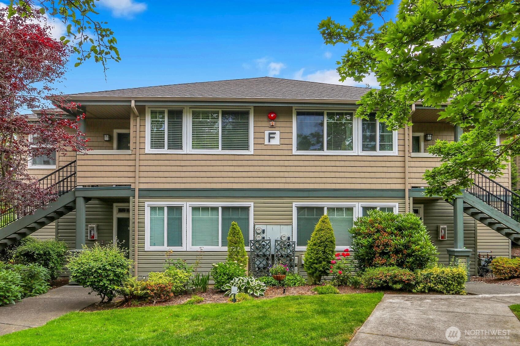 1500 South 18th Street, Unit F202 Renton, WA 98055 - Photo 3 of 20 front view of a house with a yard
