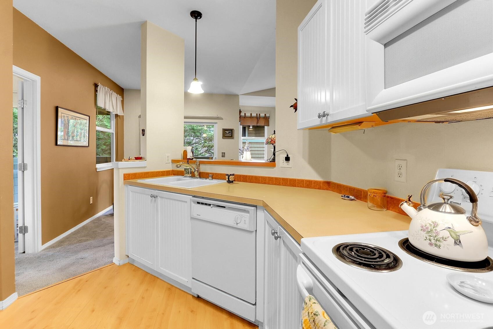 1500 South 18th Street, Unit F202 Renton, WA 98055 - Photo 10 of 20 a kitchen with a sink and cabinets