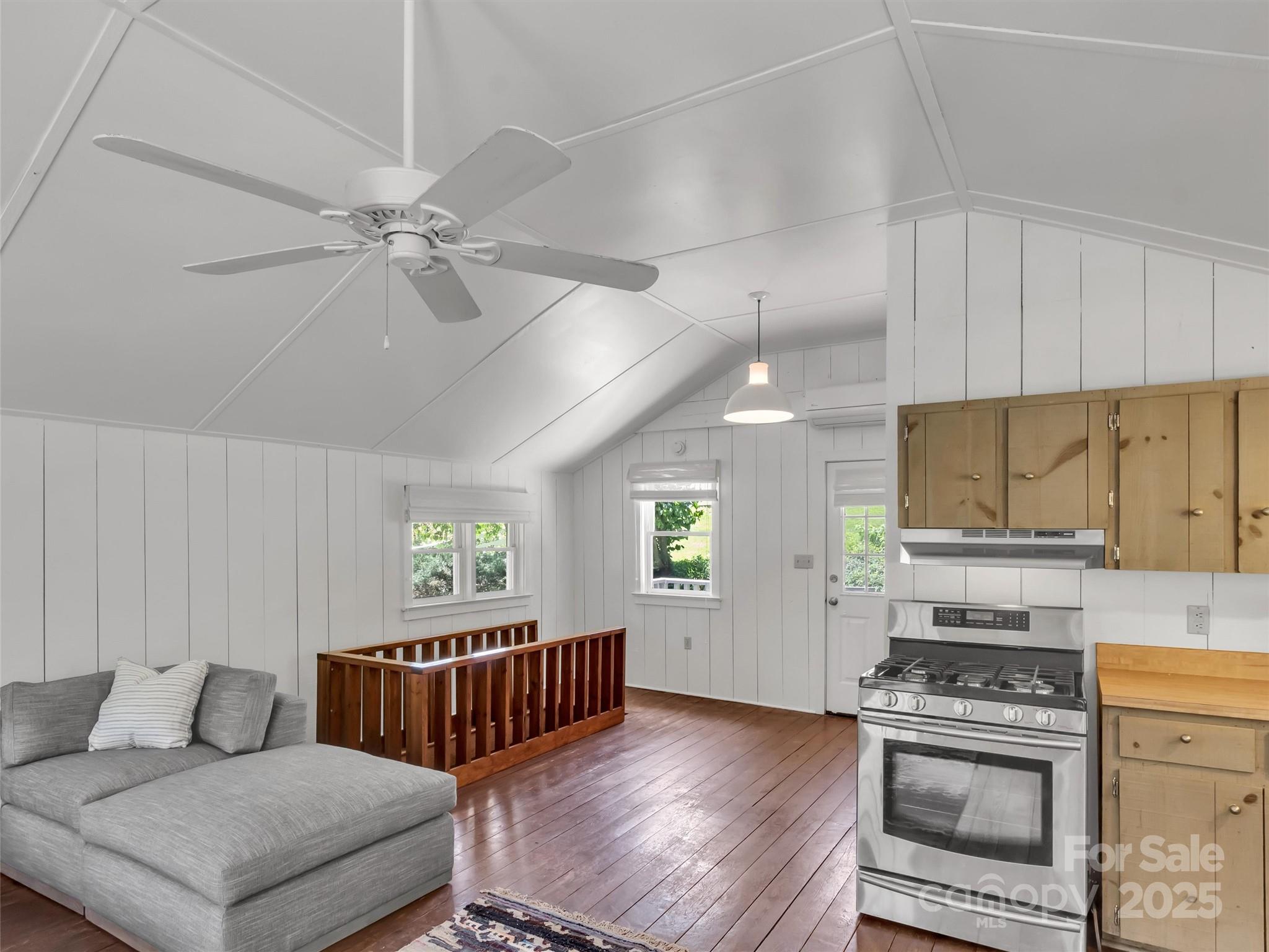 88 Plott Valley Road Waynesville, NC 28786 - Photo 41 of 48 a kitchen with a stove a sink and a refrigerator