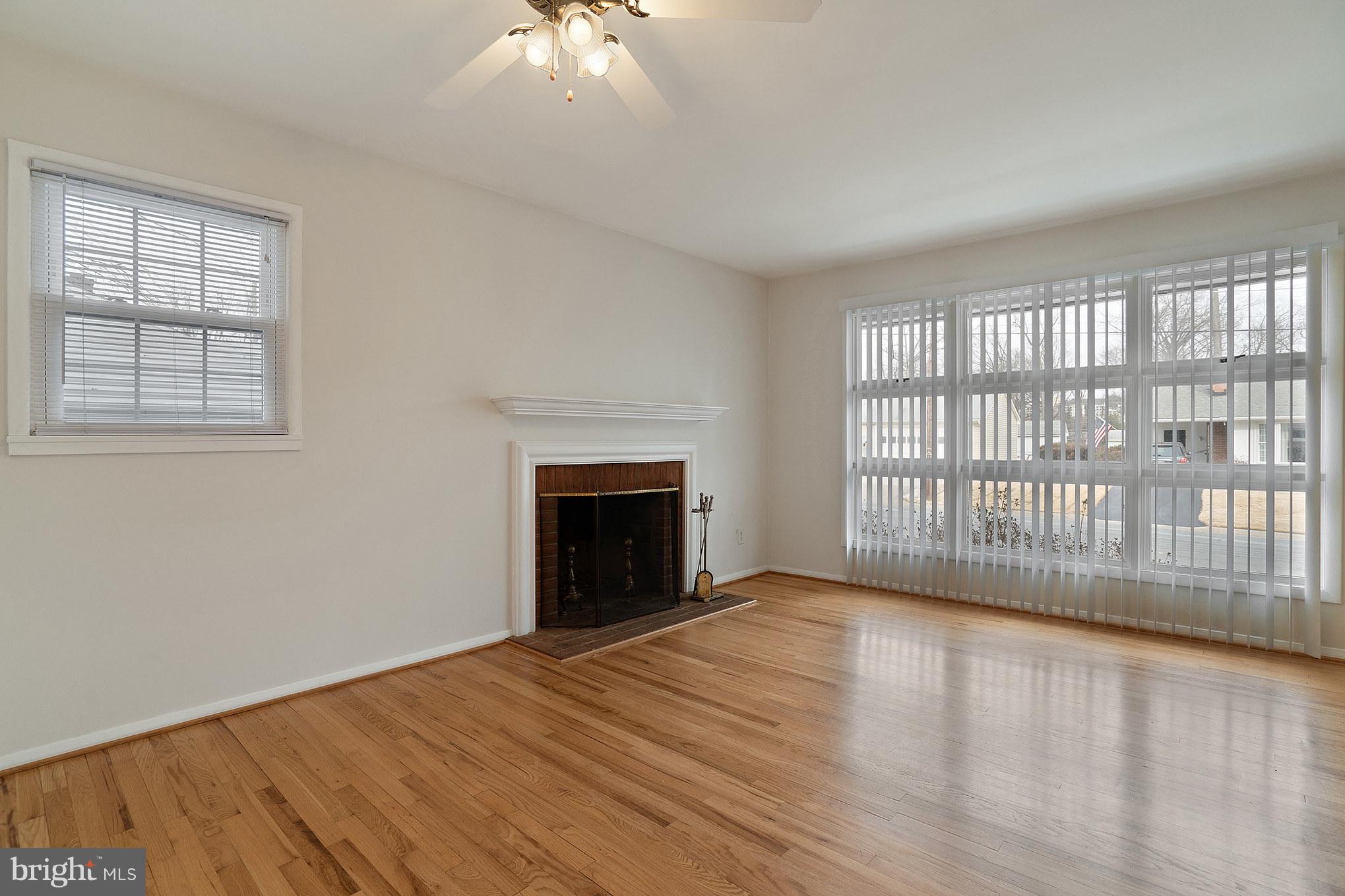 103 Rolling Road Gaithersburg, MD 20877 - Photo 2 of 28 Living Room gorgeous wood floors and fireplace.