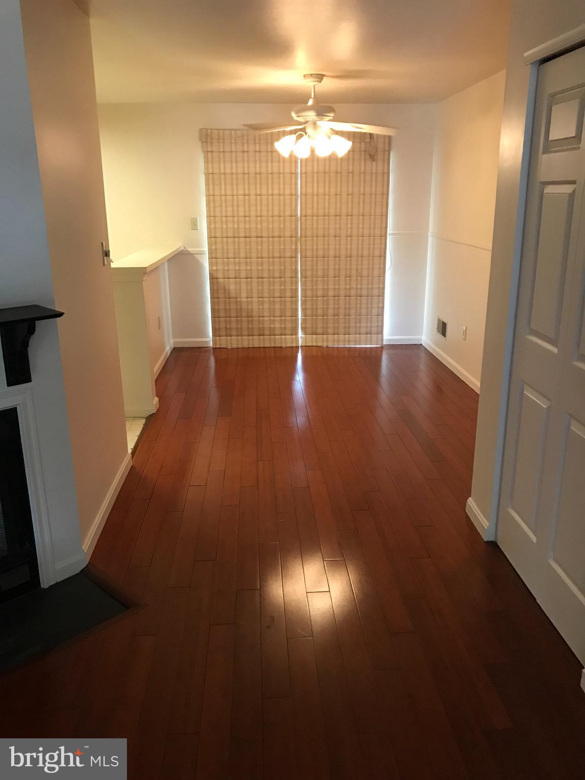 903 Christopher Drive Reading, PA 19610 - Photo 1 of 10 an empty room with wooden floor and windows