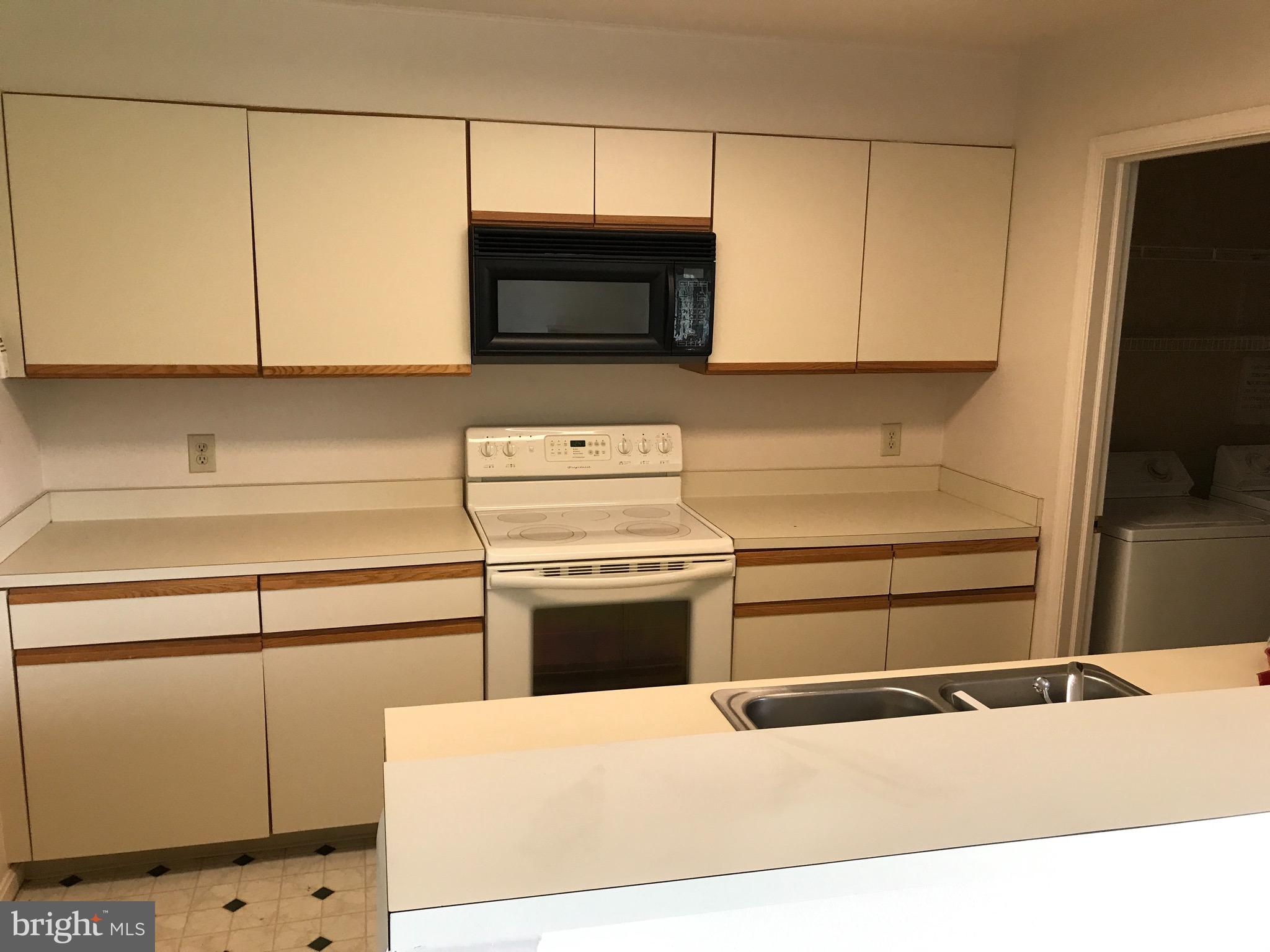 903 Christopher Drive Reading, PA 19610 - Photo 5 of 10 a kitchen with granite countertop white cabinets and stainless steel appliances