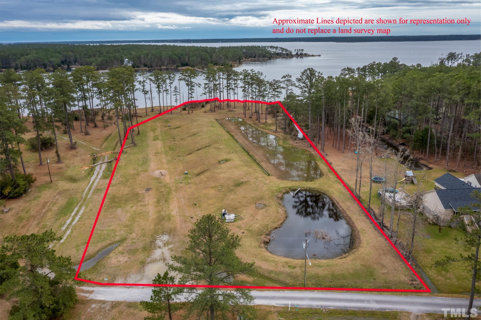 307 Griggs Road Vandemere, NC 28587 - Photo 1 of 45 a view of swimming pool with a balcony and outdoor seating