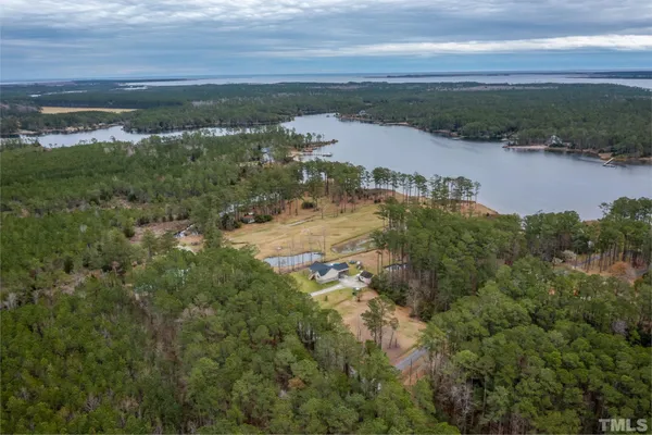 an aerial view of residential building and lake