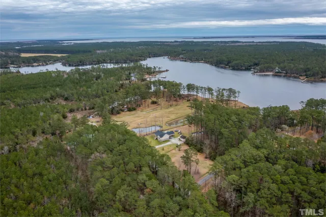 an aerial view of residential building and lake
