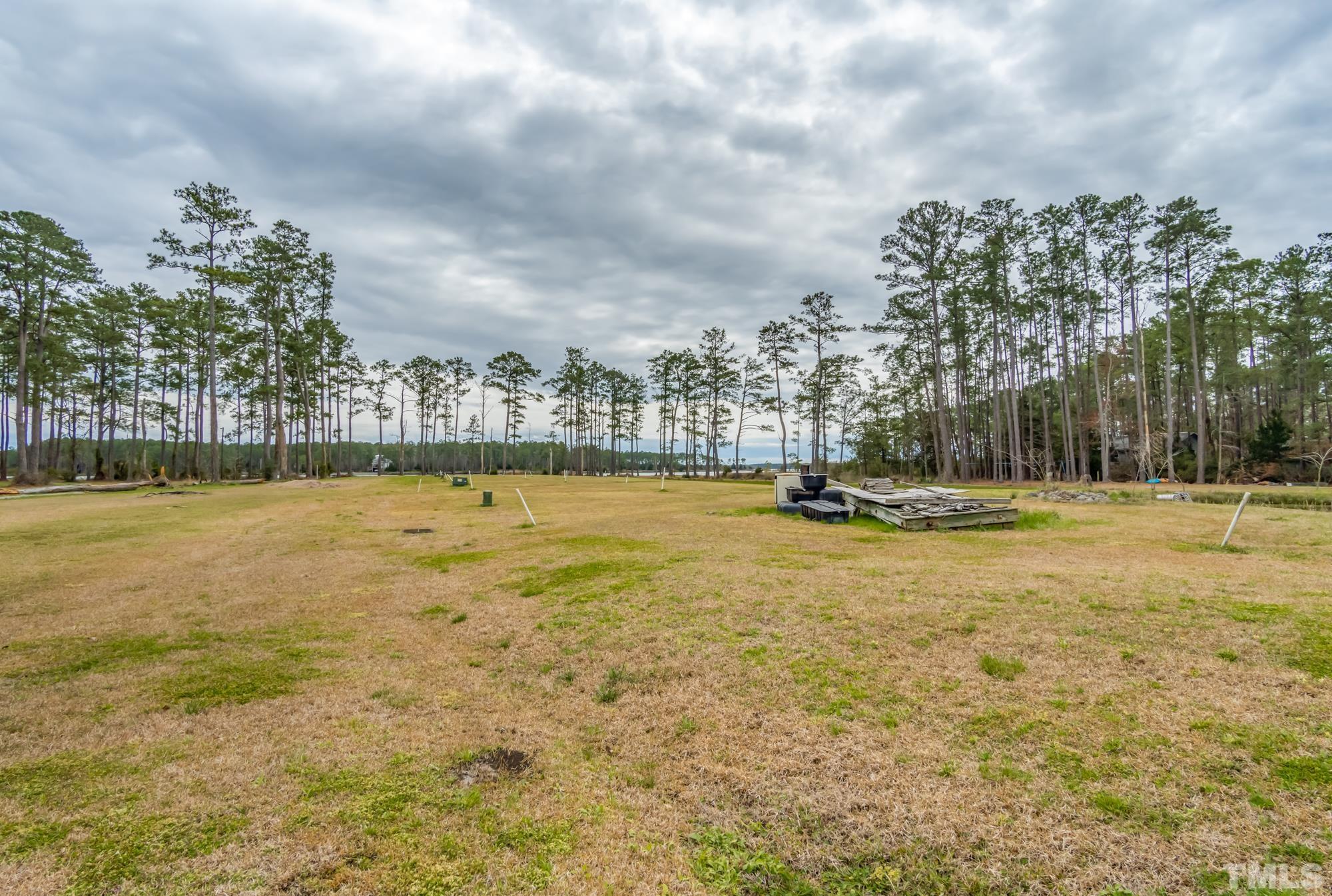 307 Griggs Road Vandemere, NC 28587 - Photo 35 of 45 a view of a swimming pool with an outdoor seating and a lake view