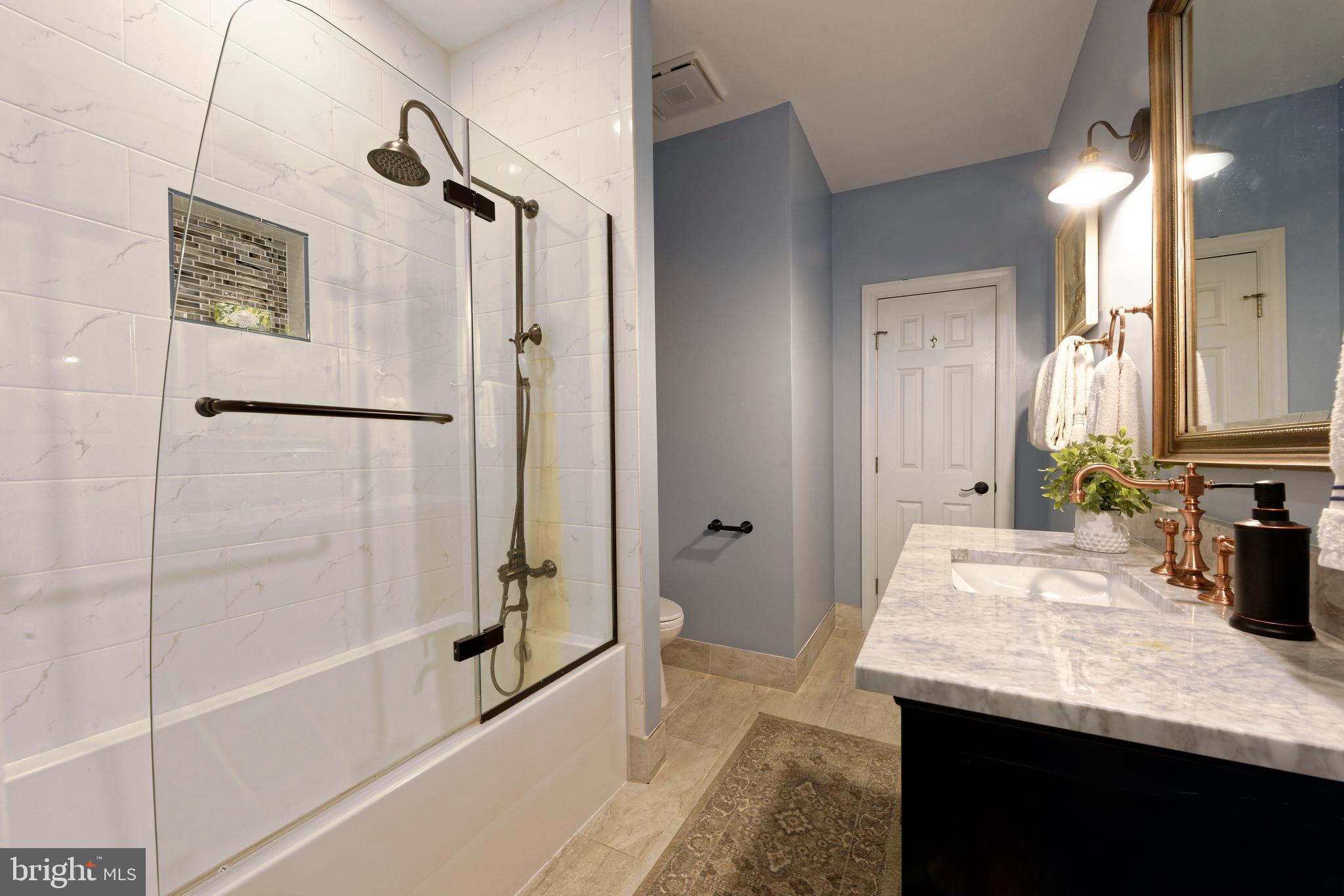 36775 Leith Lane Middleburg, VA 20117 - Photo 24 of 70 a bathroom with a granite countertop sink and a mirror